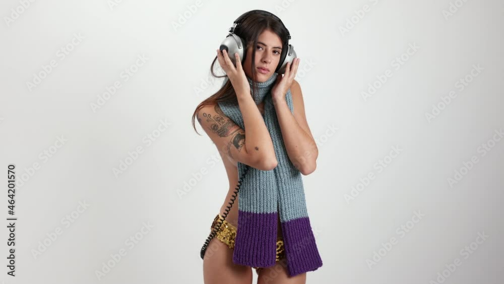 Woman posing and dancing in knitwear scarf Woman posing and dancing in knitwear scarf