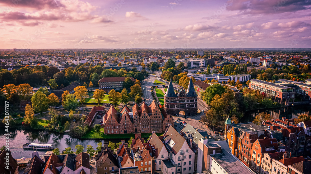 The view of the Holsten Gate and the cityscape of Lübeck in autumn