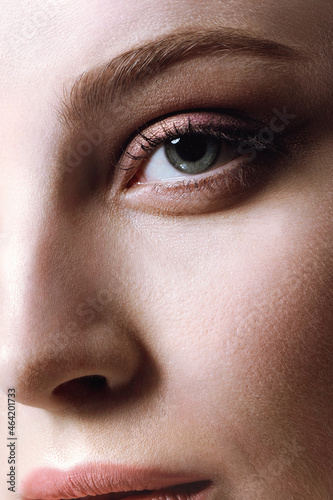 Sensual woman with perfect skin and elegance shiny makeup. Creative fantasy eye makeup, macro shot