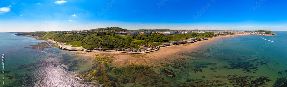 Naklejka premium Aerial panoramic photo of the seaside village of Filey in the UK showing a wide view image of the sea front and coastal hotels in the summer time