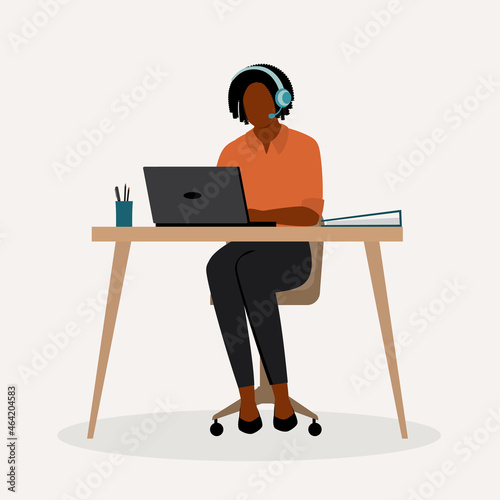 Black Female Customer Support Representative With Headset Working With Computer.