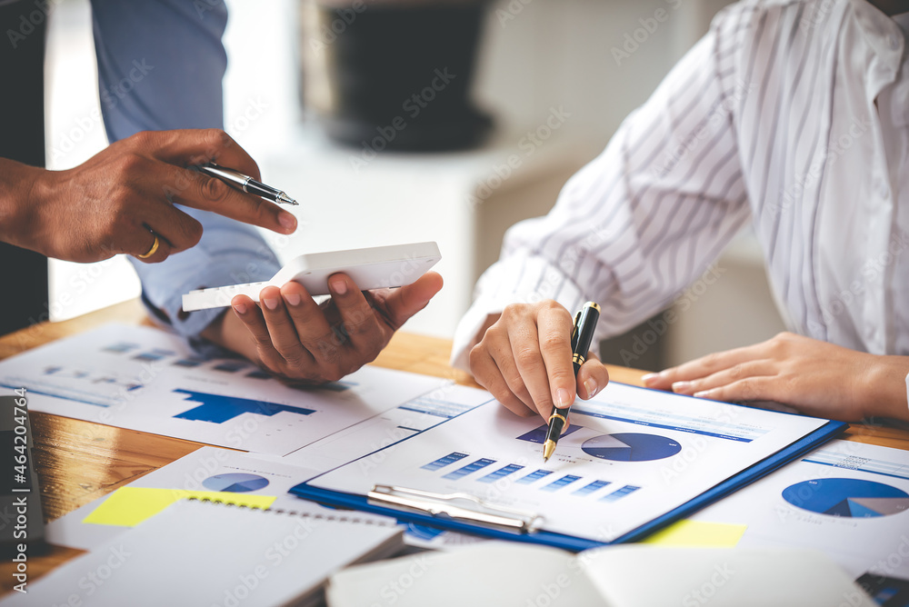 Team work with business analytic price chart on the table at the conference room. Team work with business analytic price chart on the table at the conference room.