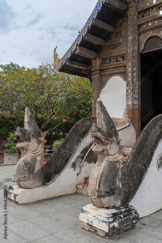 View of ancient naga staircase entrance to beautiful Lanna style viharn at historic Wat Prasat buddhist temple, Chiang Mai, Thailand - obrazy, fototapety, plakaty 
