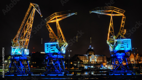 Illuminated cranes in the night