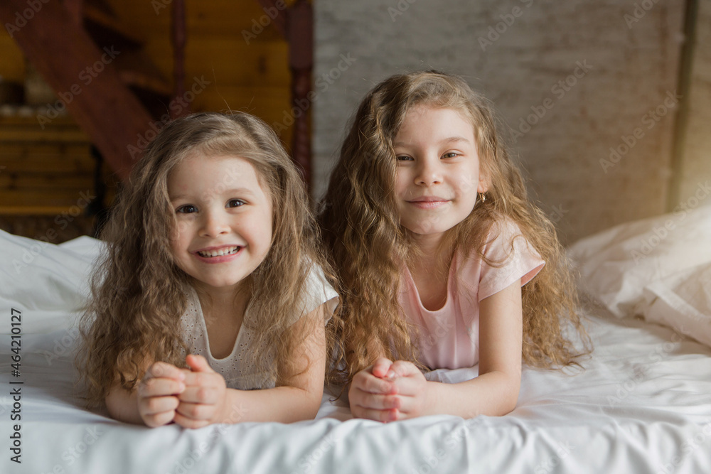 morning family: the children playing in bed. waking up from a dream. I just woke up. love morning family: the children playing in bed. waking up from a dream. I just woke up. love