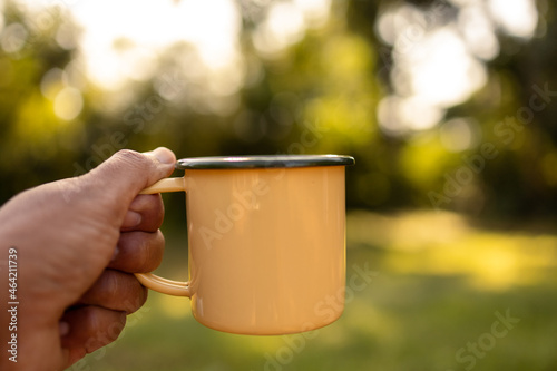 Coffee mugs in the backyard and morning sunshine.