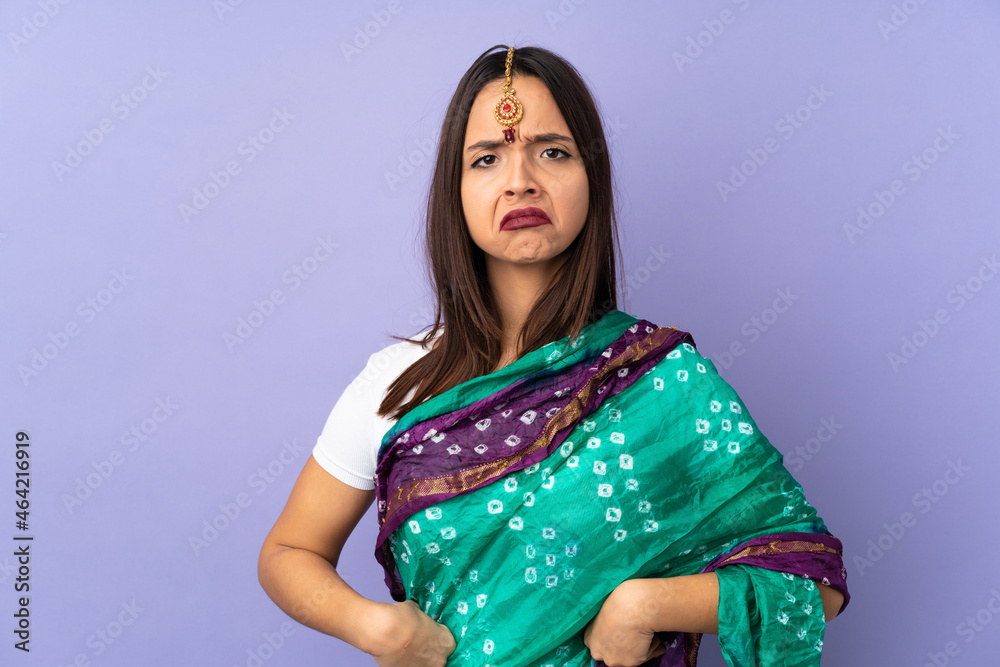 Young Indian woman isolated on purple background angry Young Indian woman isolated on purple background angry