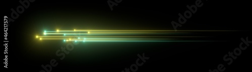 Glowing particles tracing yellow and orange light on black background. 