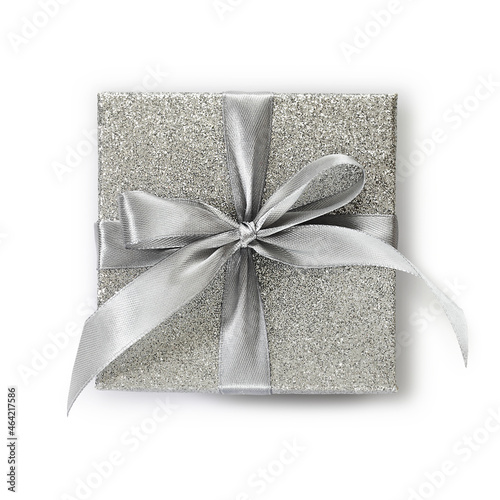 gift silver glittering box with ribbon bow, isolated on white background, top view, useful for merry christmas, black friday, cyber Monday or valentine day shopping concept © amedeoemaja