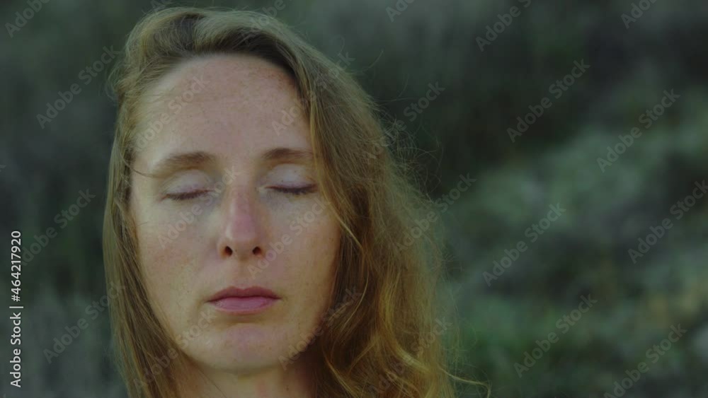 Meditation. Yoga. Detached Female Face with Freckles with Closed Eyes