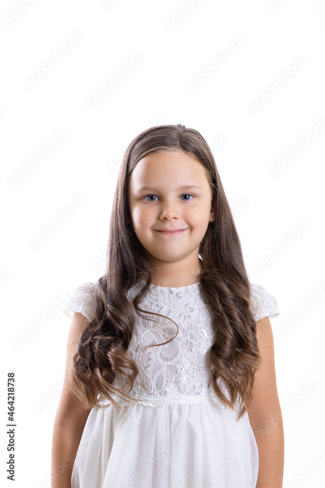 portrait of smiling, modest girl with long curls in white dress, isolated on white background with copy space. 