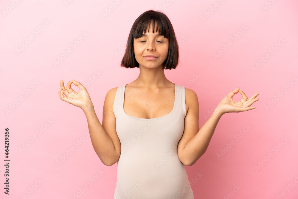 Young pregnant woman over isolated pink background in zen pose Young pregnant woman over isolated pink background in zen pose
