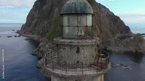Abandoned Lighthouse Aniva on the Rock in Sakhalin Island, Russia. Drone Shot.