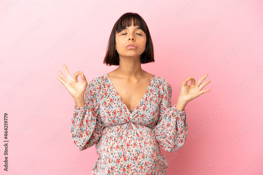 Young pregnant woman over isolated pink background in zen pose Young pregnant woman over isolated pink background in zen pose