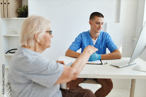 elderly woman patient talking to doctor health care