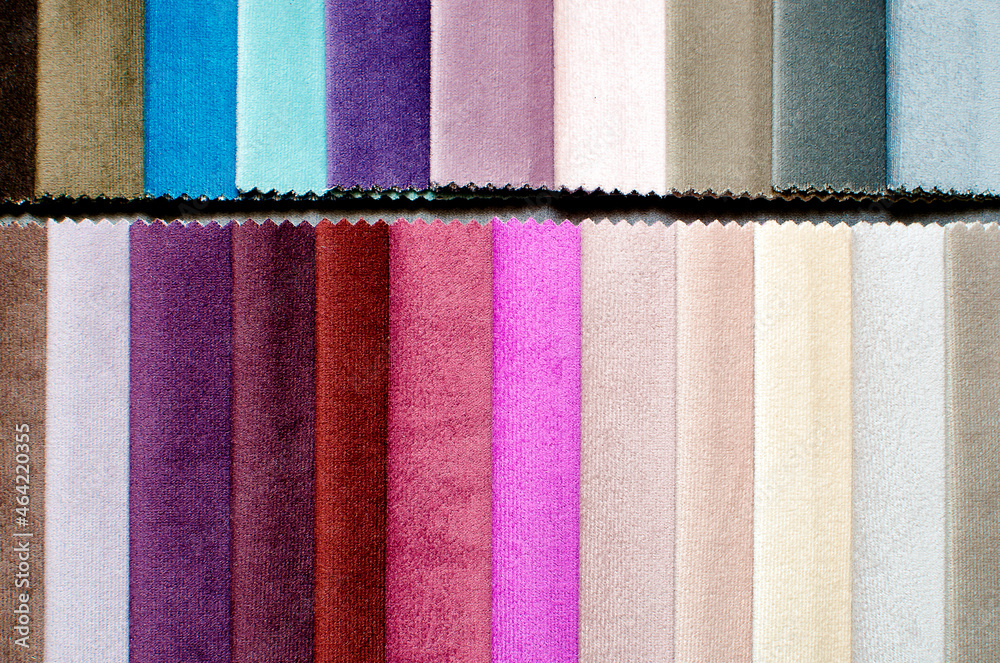 Fototapeta premium Colorful and bright curtains fabric pattern palette texture samples as abstract textile background. clothes and furniture decoration concept. Scraps of colored tissue close up