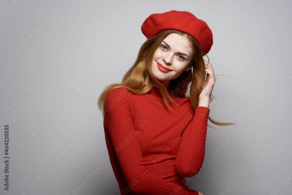 cheerful woman with a red cap on his head glamor isolated background cheerful woman with a red cap on his head glamor isolated background