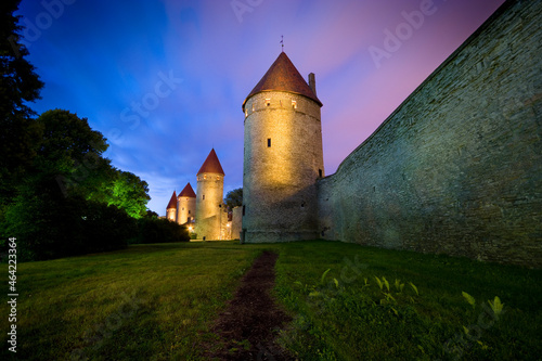 Night view of illuminated defensive city walls of Estonian capital - Tallinn
