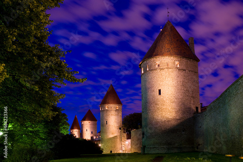 Night view of illuminated defensive city walls of Estonian capital - Tallinn