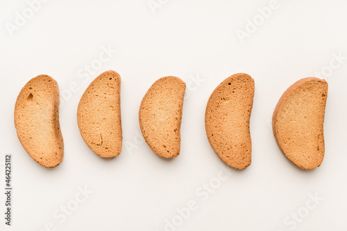 Breadcrumbs on a white plate. Rusks on a white background. Vanilla rusks.