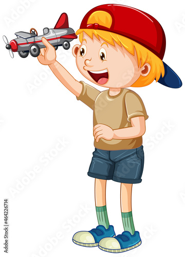 A boy wearing helmet playing airplane toy