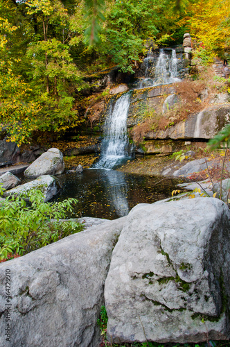 waterfall in a river with water, autumn nature