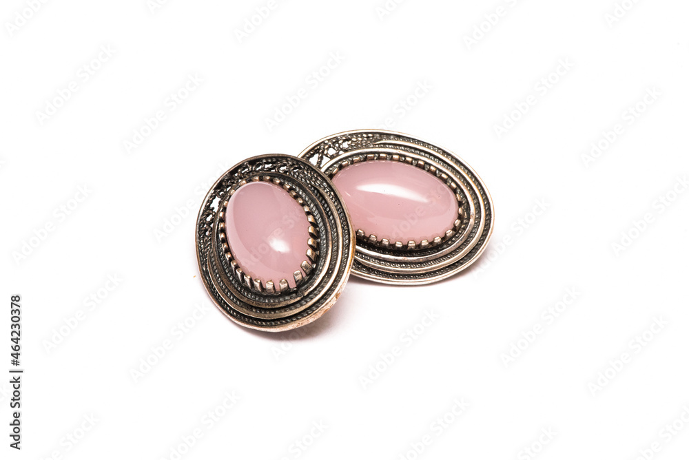 Silver earrings with rose quartz isolated on the white background. Silver earrings with rose quartz isolated on the white background.