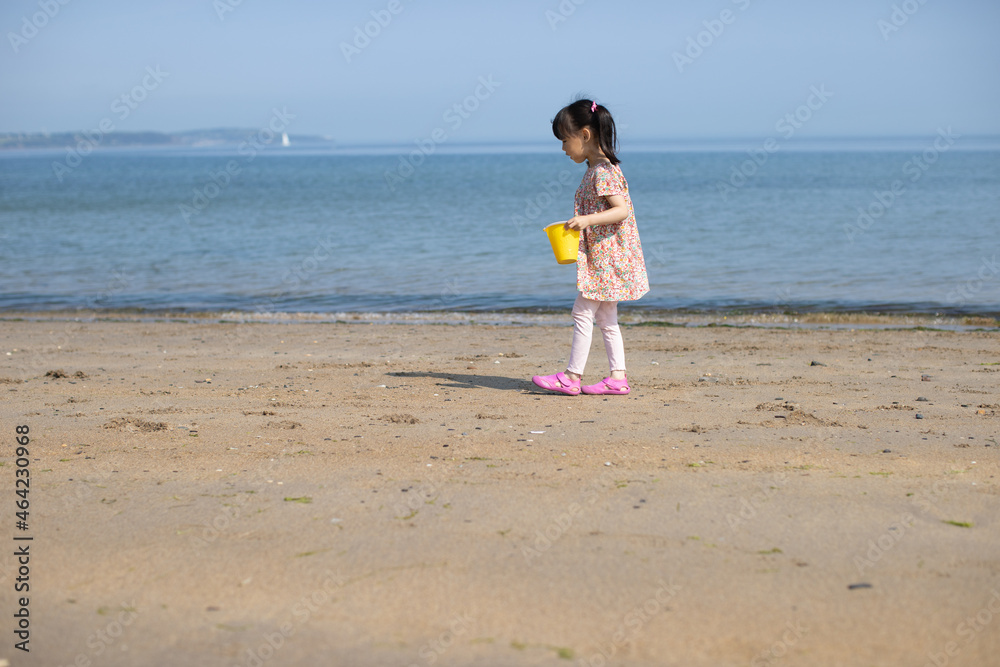 young girl playing at summer sand beach young girl playing at summer sand beach