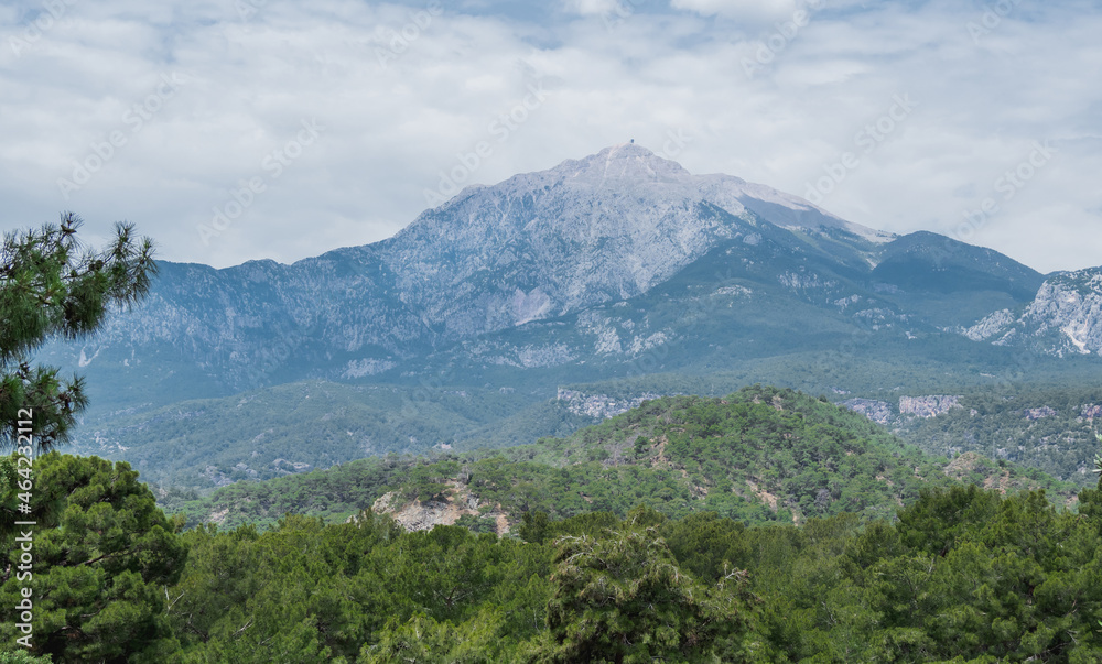 Mountain Tahtali Dagi, also known as Lycian Olympus among forests. Spring landscape. Turkey. Mountain Tahtali Dagi, also known as Lycian Olympus among forests. Spring landscape. Turkey.