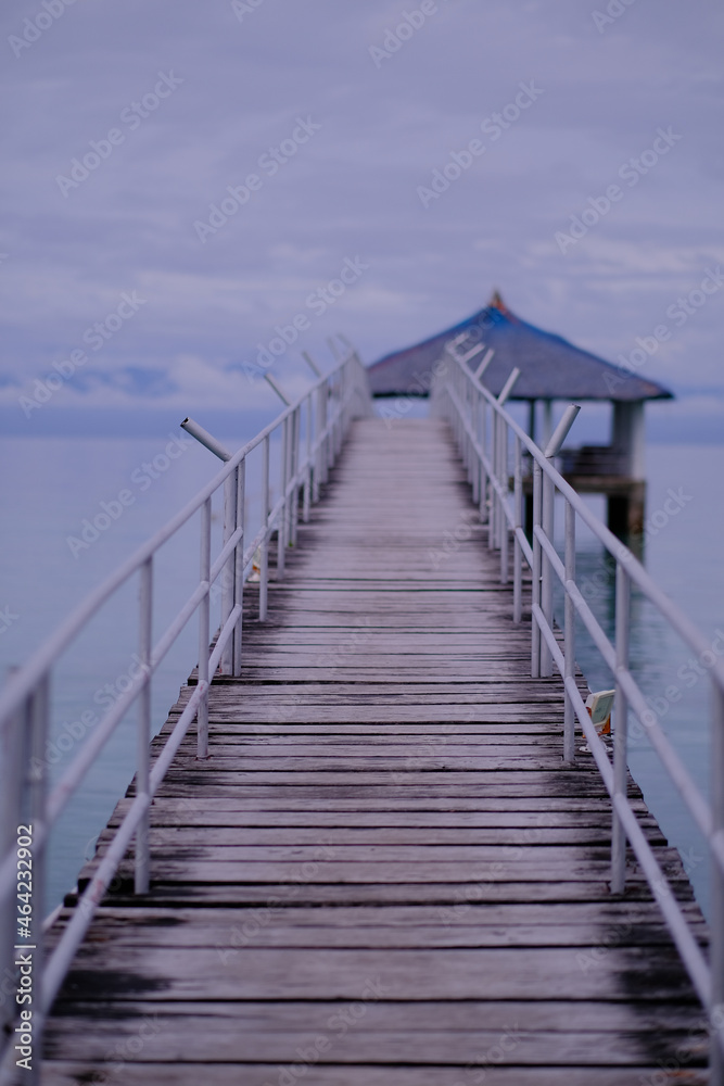 Using a wide aperture, the camera was focused in the middle of the foot bridge that connects the shoreline to the cottage in the middle of the sea. Using a wide aperture, the camera was focused in the middle of the foot bridge that connects the shoreline to the cottage in the middle of the sea.