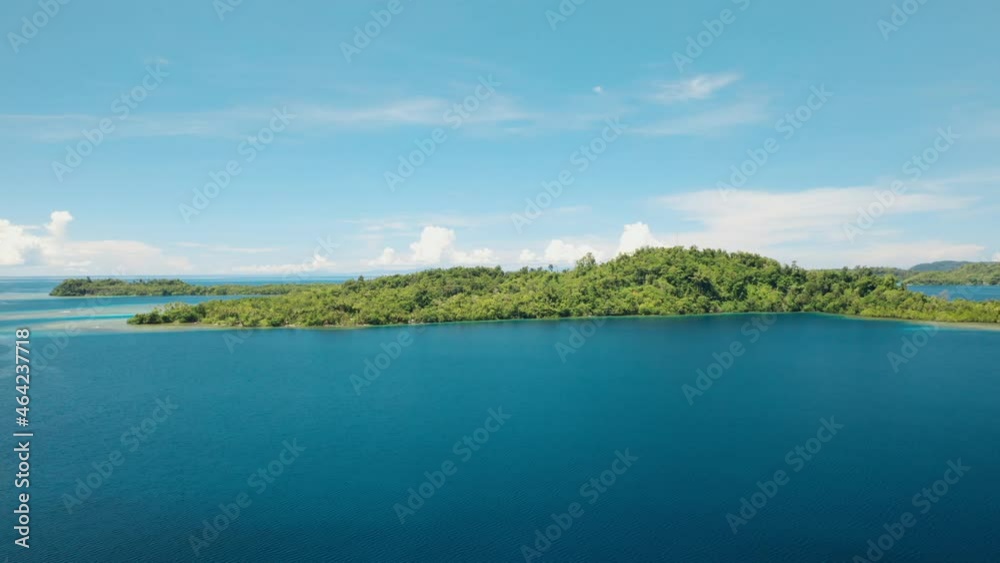 Aerial drone wide view of a tropical island in a big harbour. Aerial drone wide view of a tropical island in a big harbour.