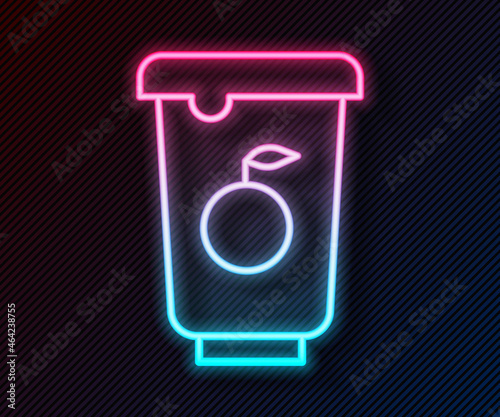 Glowing neon line Yogurt container icon isolated on black background. Yogurt in plastic cup. Vector