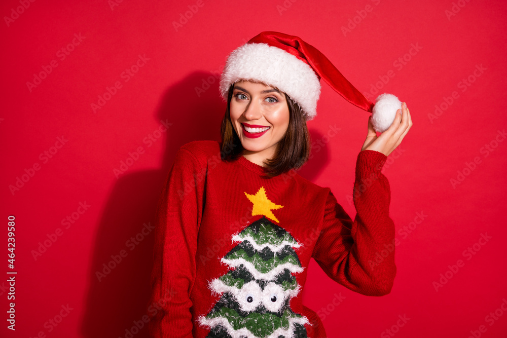 Photo of charming sweet young lady dressed print pullover smiling celebrating christmas isolated red color background Photo of charming sweet young lady dressed print pullover smiling celebrating christmas isolated red color background
