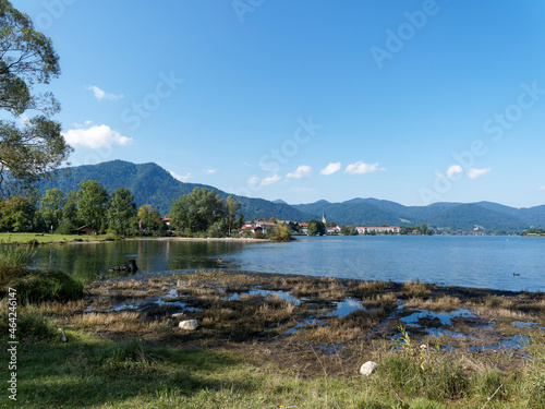 On the shore of Lake Tegernsee in Upper Bavaria Germany with a view of the Rottach Egern swimming area and the Bavarian Alps on background
