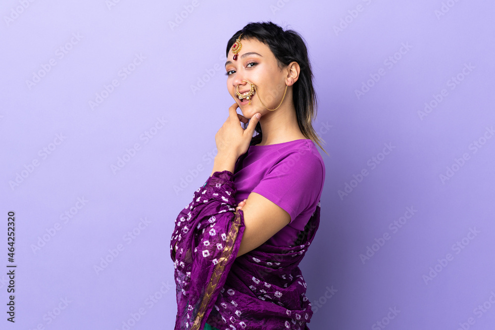 Indian woman isolated on purple background happy and smiling Indian woman isolated on purple background happy and smiling