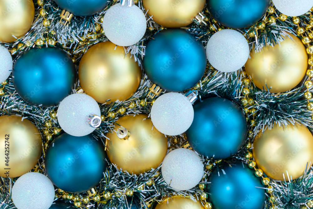 christmas or new year background with gold. white and blue christmas balls, golden beads. flat lay christmas or new year background with gold. white and blue christmas balls, golden beads. flat lay