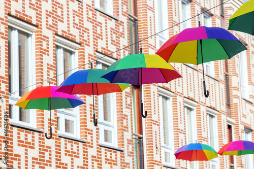 city street with rainbow colored umbrellas at a line in Nijmegen, Netherlands © Christian Müller
