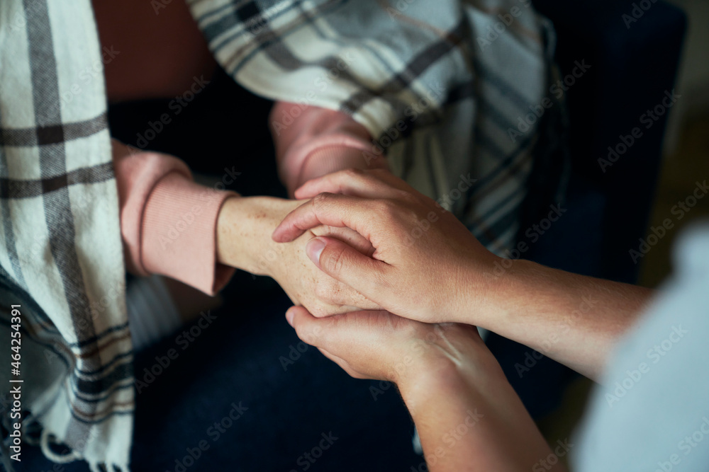 Detail of caucasian hands consoling each other