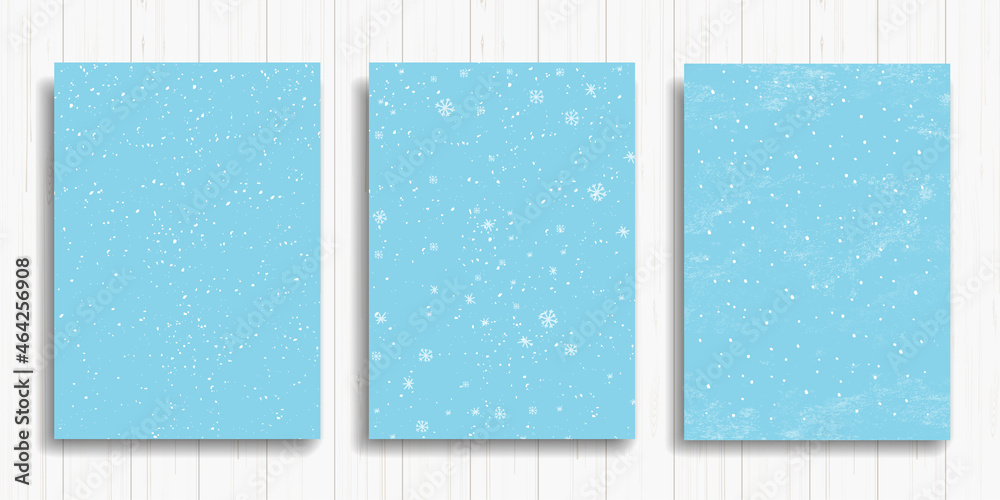 Set of winter snowfall and snowflakes on light blue background. Hand drawn snow pattern. Doodle cold winter sky backgrounds. Vector illustration