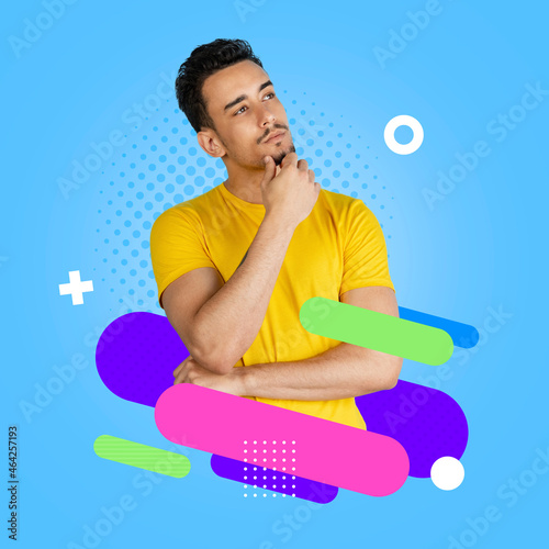 Contemporary artwork. Young serious man in yellow t-shirt isolated on colorful neon backgroud. Human emotions concept. photo