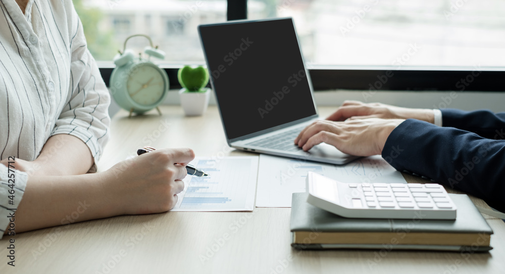Two business leaders talk about charts, financial graphs showing results are analyzing and calculating planning strategies, business success building processes