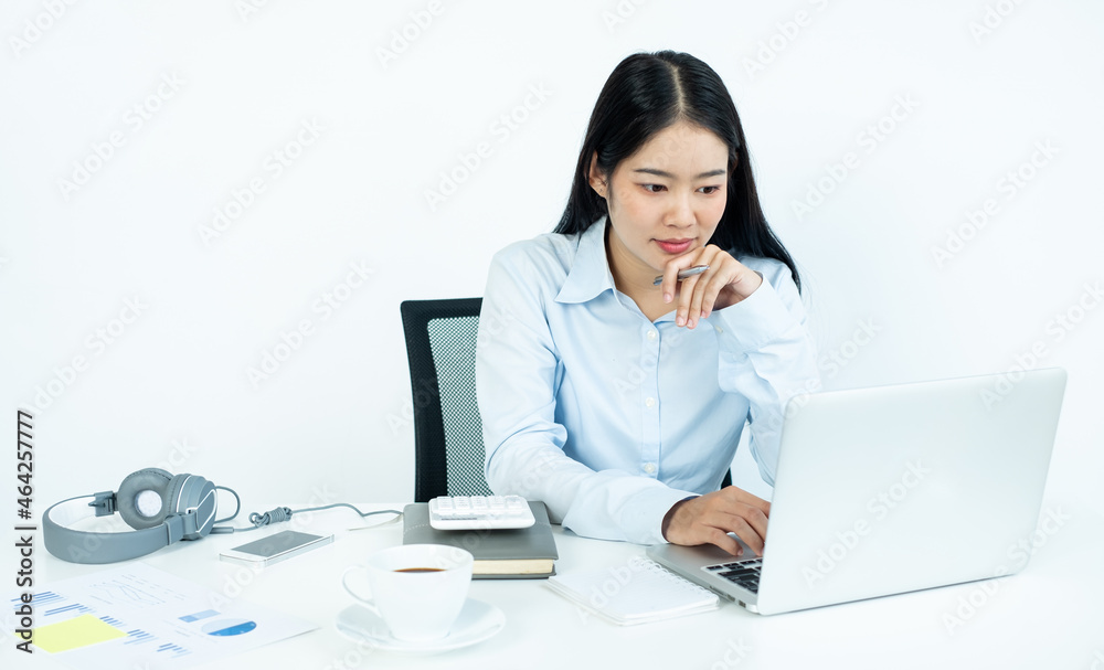 Working Asian women feel stressed, dismal tired from work, migraine headaches from hard work while working at the office Working Asian women feel stressed, dismal tired from work, migraine headaches from hard work while working at the office