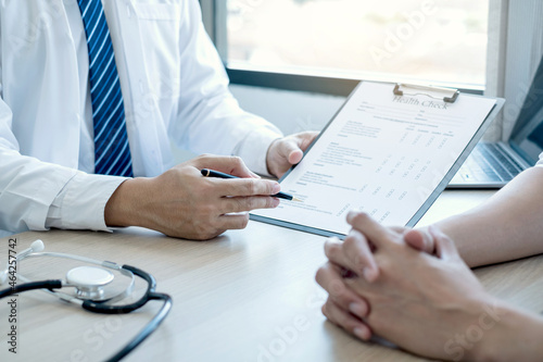 Man doctors explain and recommend treatment after a female patient meets a doctor and receives results regarding illness problems. Medical and health care concepts