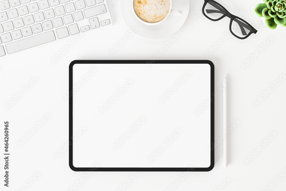 Top view of blank screen tablet on white working desk Top view of blank screen tablet on white working desk