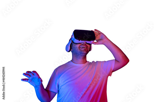 Young man using virtual reality glasses isolated getting happy.