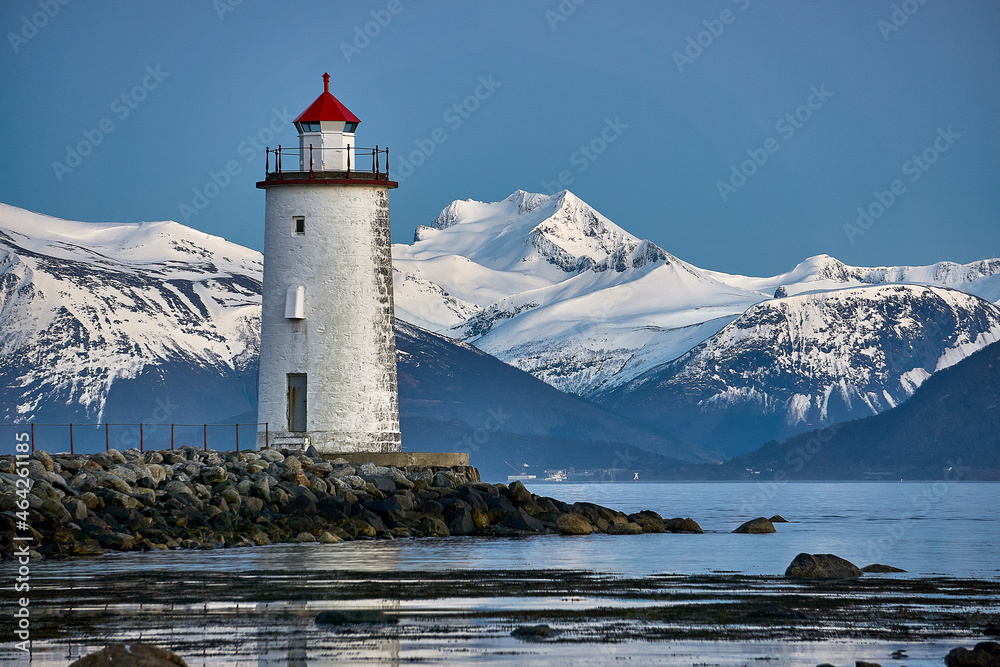 Høgstein lighthouse watching over the Sunnmøre alps, Godøy, Norway