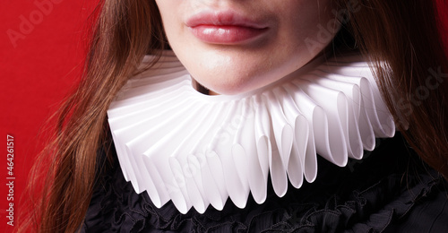 white ruff or ruffled collar worn by unrecognizable lady photo