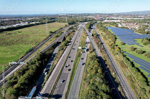 Aerial top view of road junction motorway from above, automobile traffic cars, transportation United Kingdom.