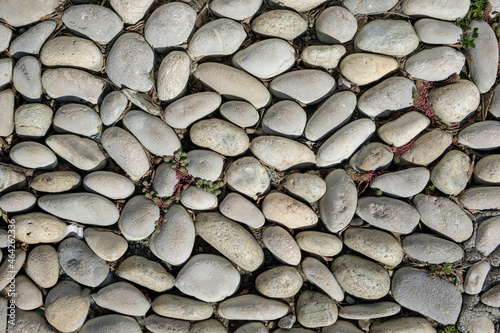 stone surface of smooth stones. decorative masonry photo