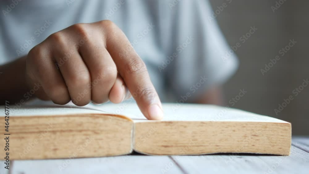 child boy hand reading a book on a table , child boy hand reading a book on a table ,